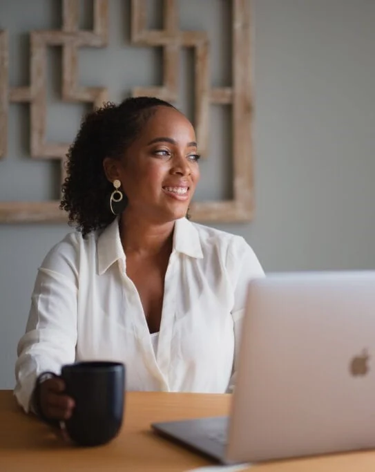 African professional working on a laptop
